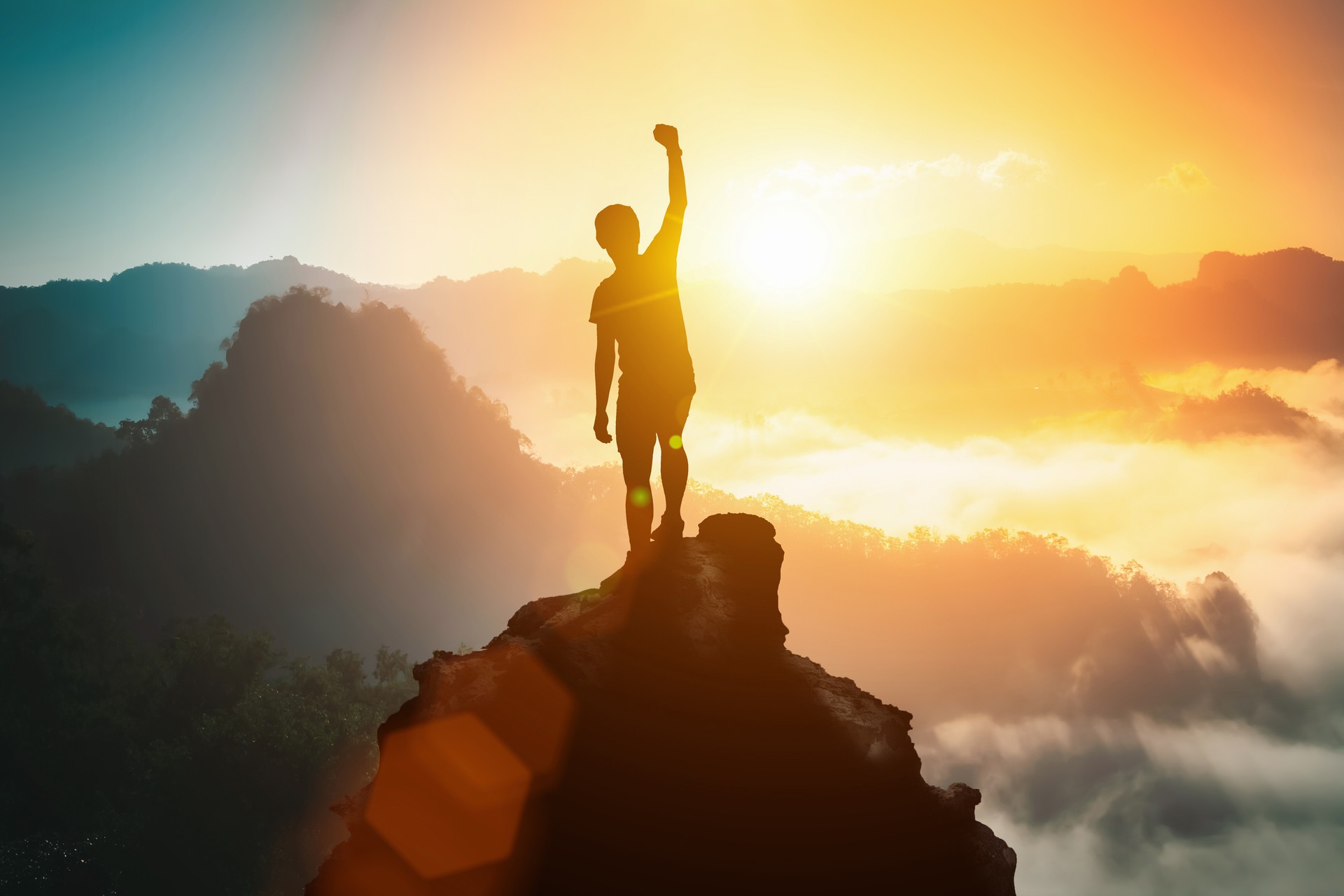 Silhouette of positive man celebrating on mountain top, with arms raised up, silhouette of man standing on the hill, Business, success,victory,leadership,achievement concept. Freedom travel adventure. Silhouette of positive man celebrating on mountain top, with arms raised up, silhouette of man standing on the hill, Business, success,victory,leadership,achievement concept. Freedom travel adventure.